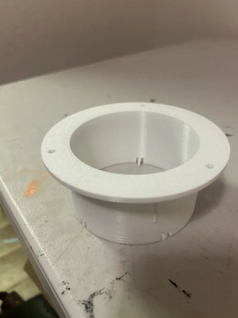 3D printed downspout transition flange on the workbench