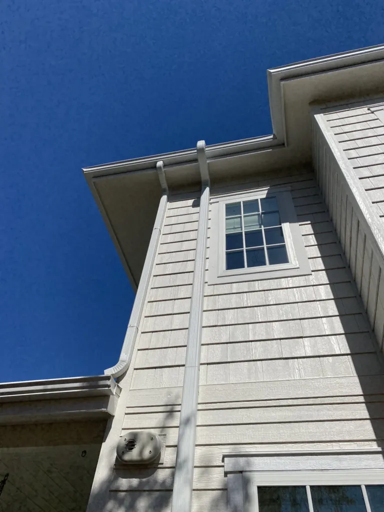 Radon mitigation system with 3D printed transition from round to rectangular downspout, color matched to trim